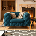 Fauteuil club en velours capitonné